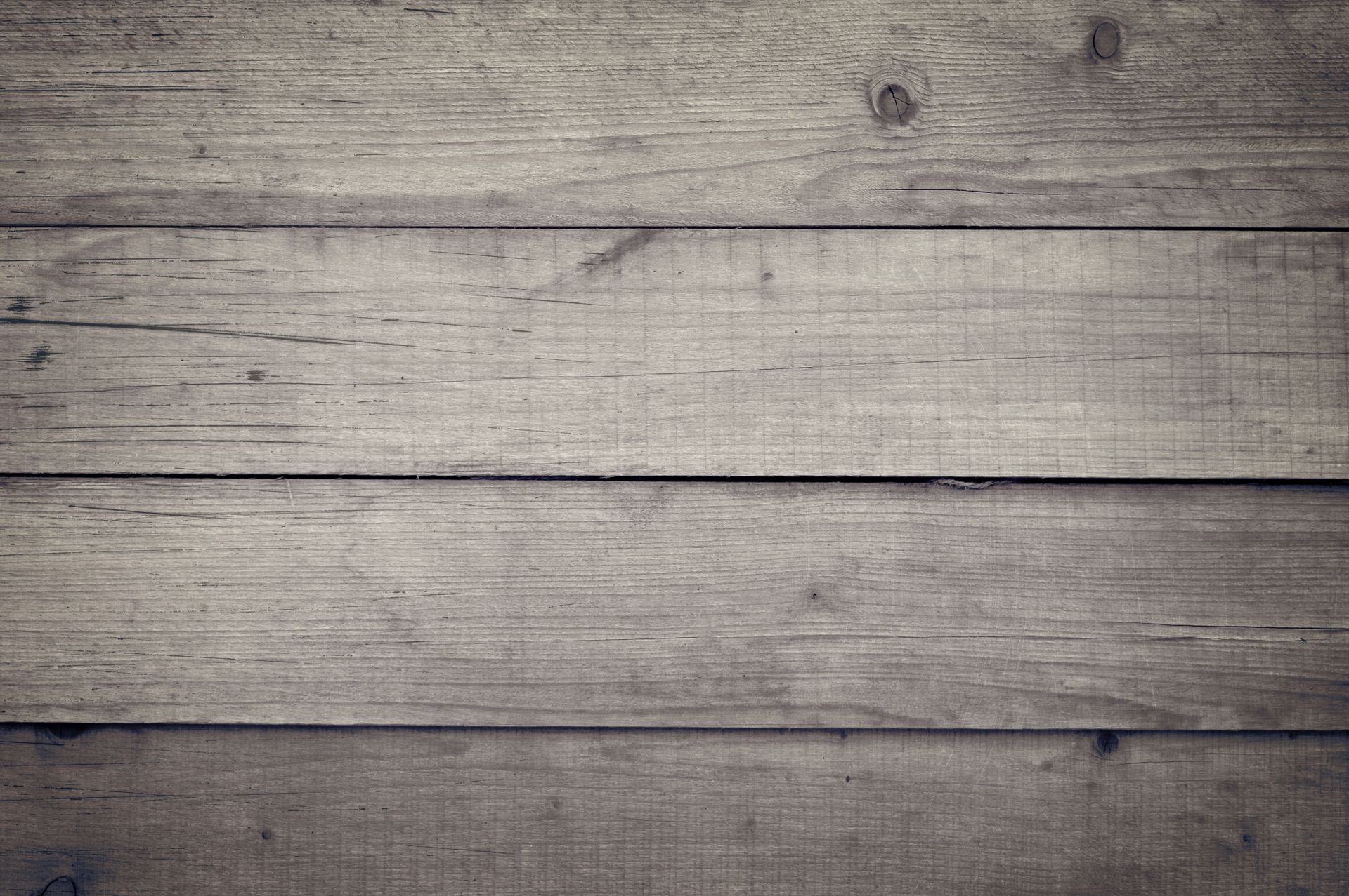 A rustic wooden plank texture ideal for backgrounds and design projects.