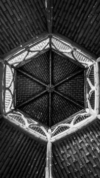 Intricate hexagonal stone ceiling pattern captured in a Brazilian church.