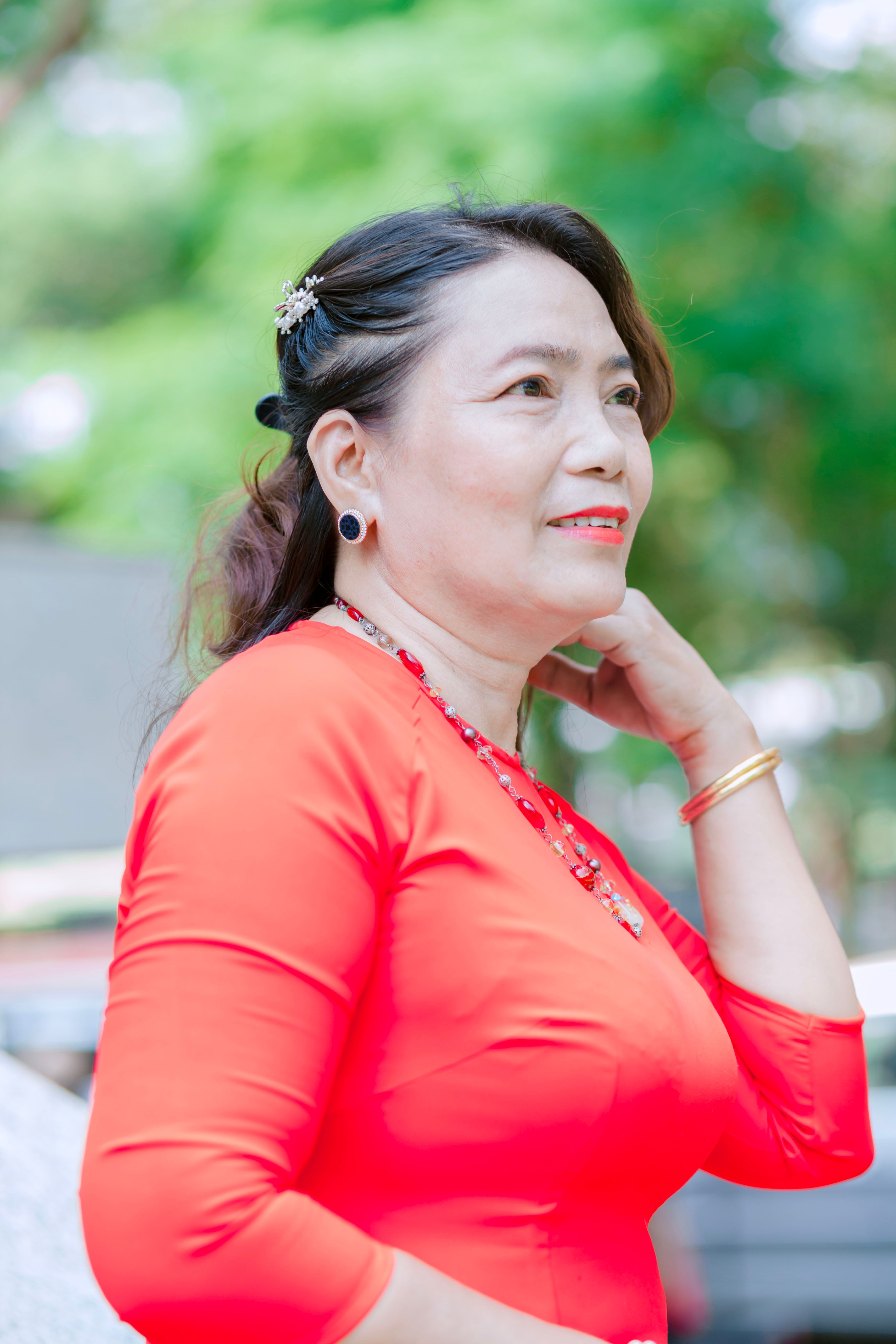 Portrait of a Woman Posing in a Red Dress · Free Stock Photo