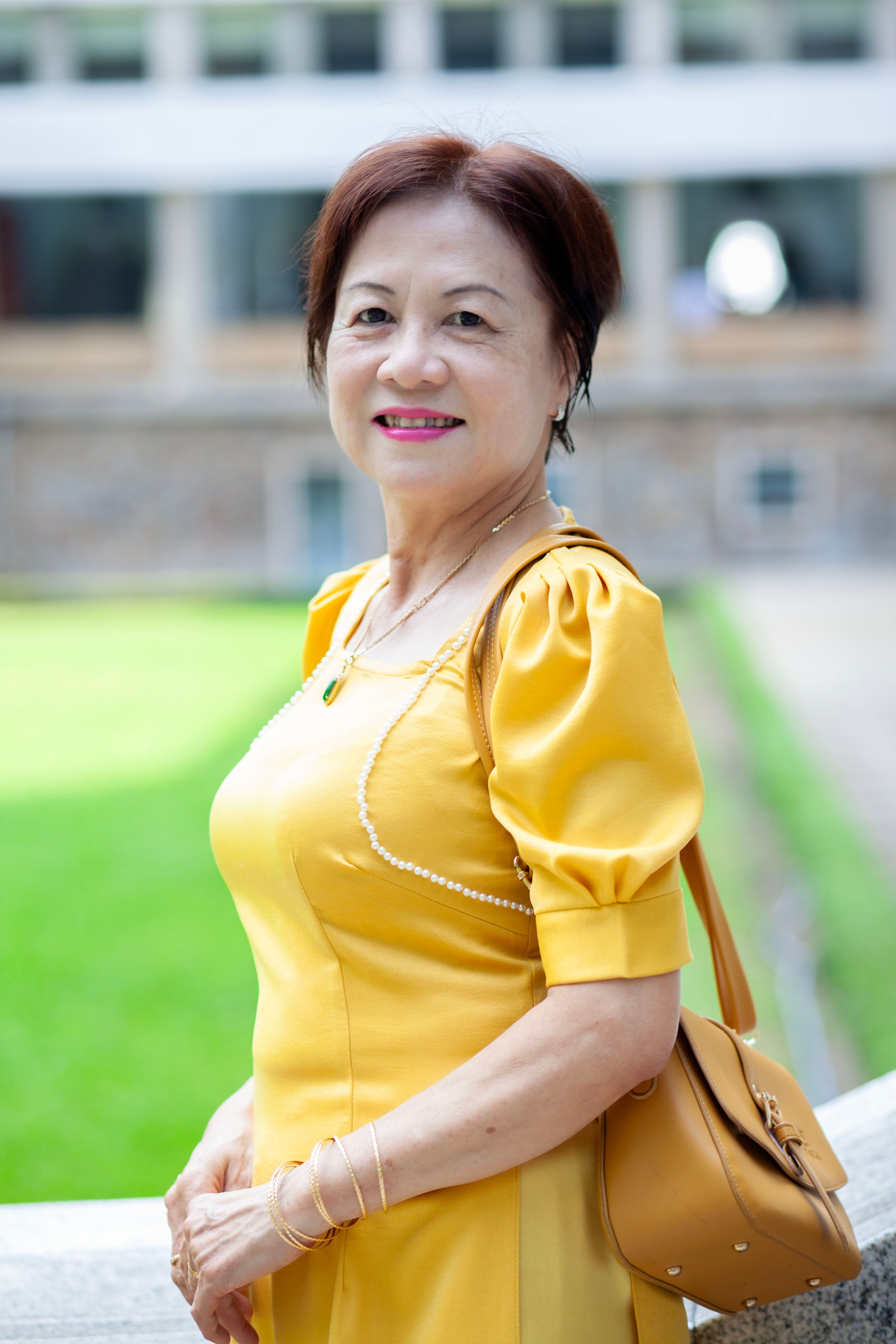 Woman Posing in a Yellow Dress · Free Stock Photo