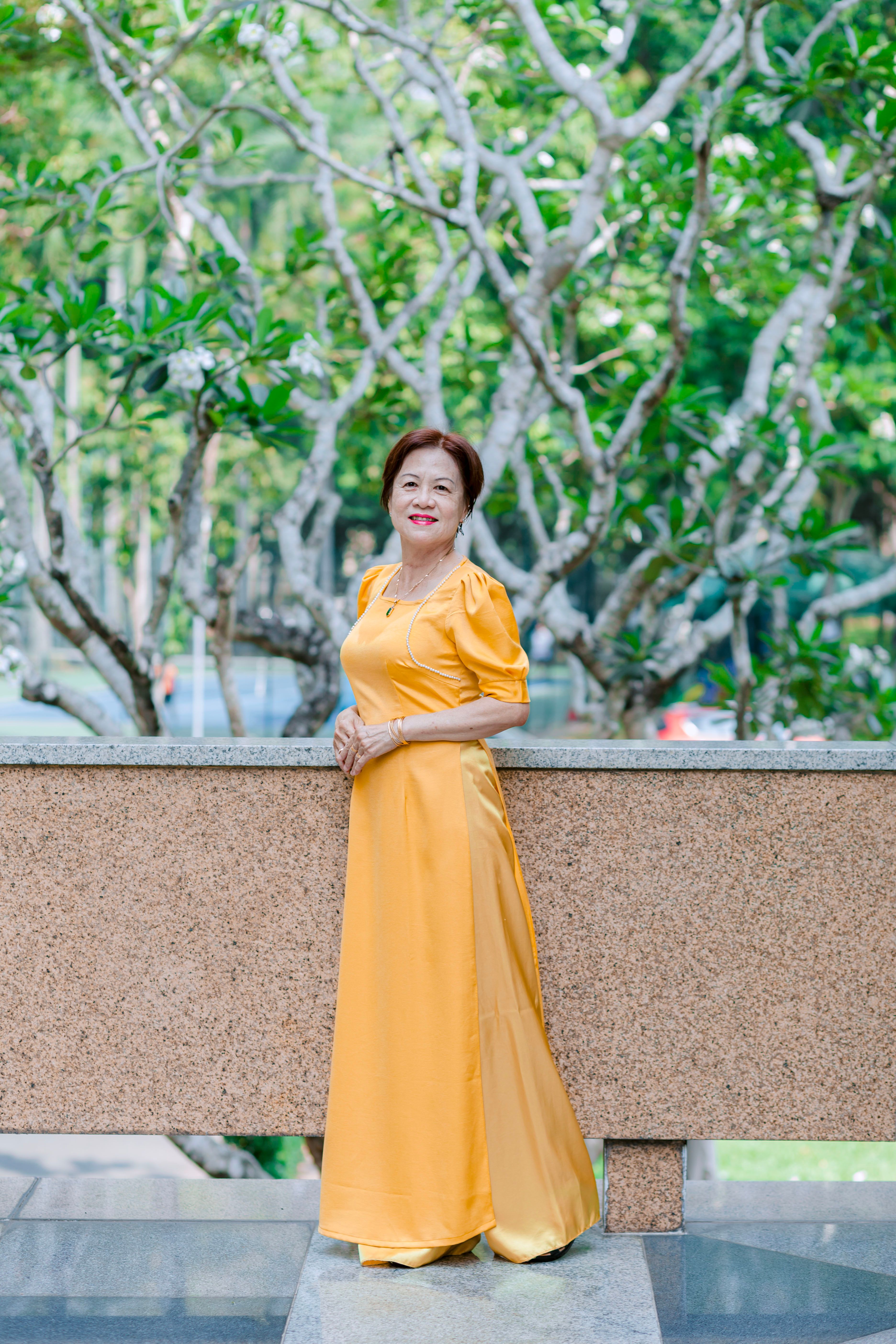 Woman Posing in a Yellow Dress · Free Stock Photo