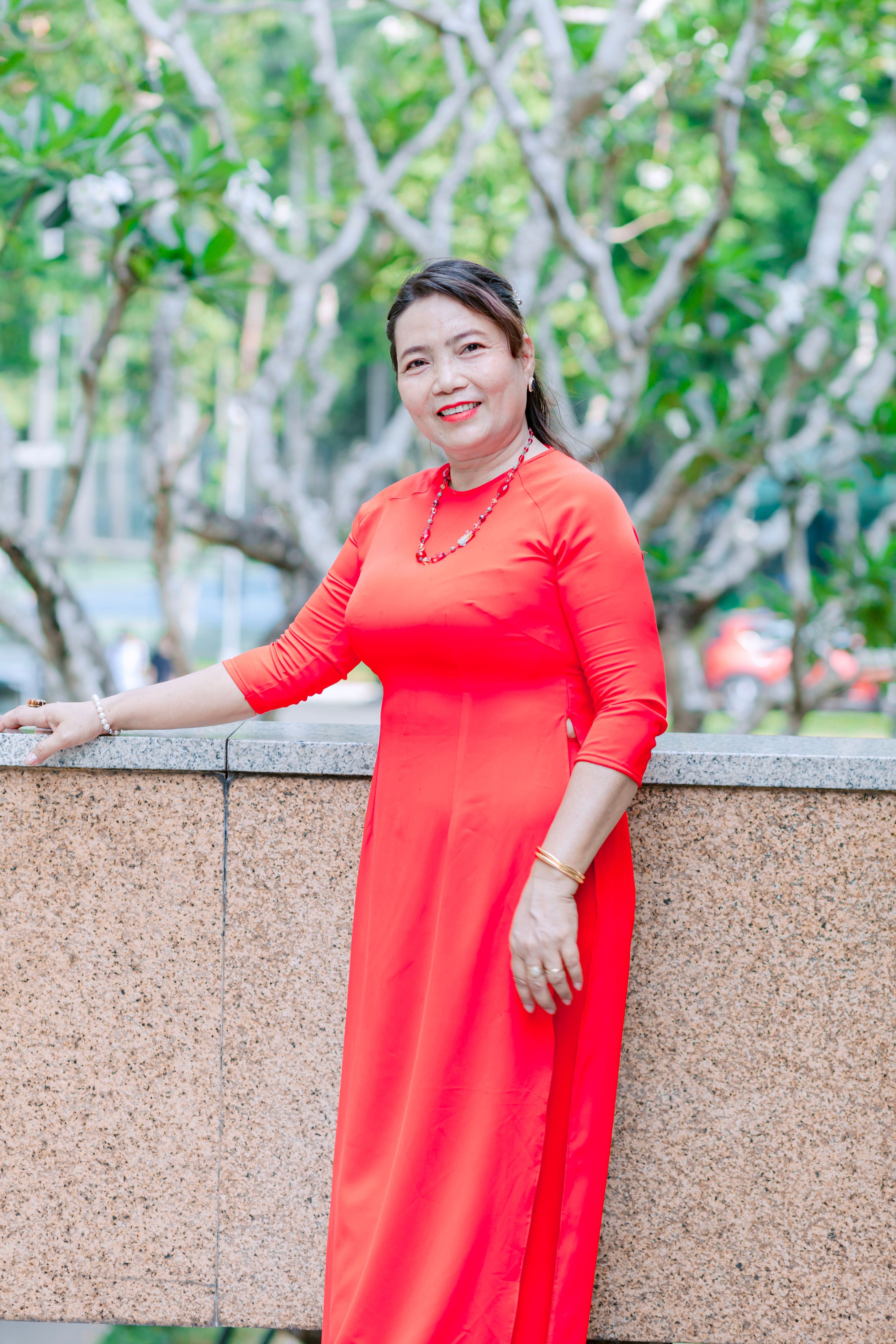 Woman Posing in a Red Dress · Free Stock Photo