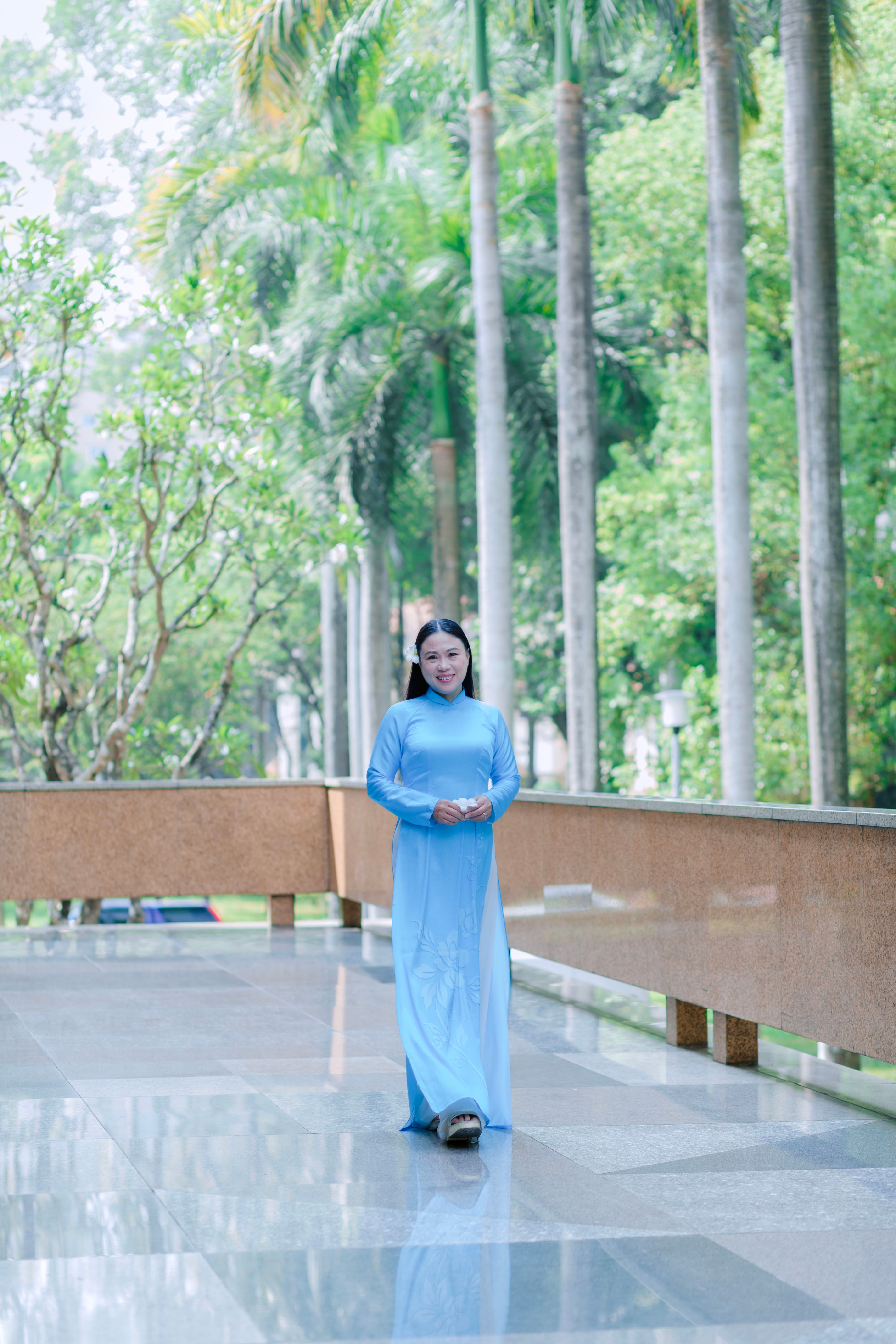 Woman Posing in a Blue Dress · Free Stock Photo