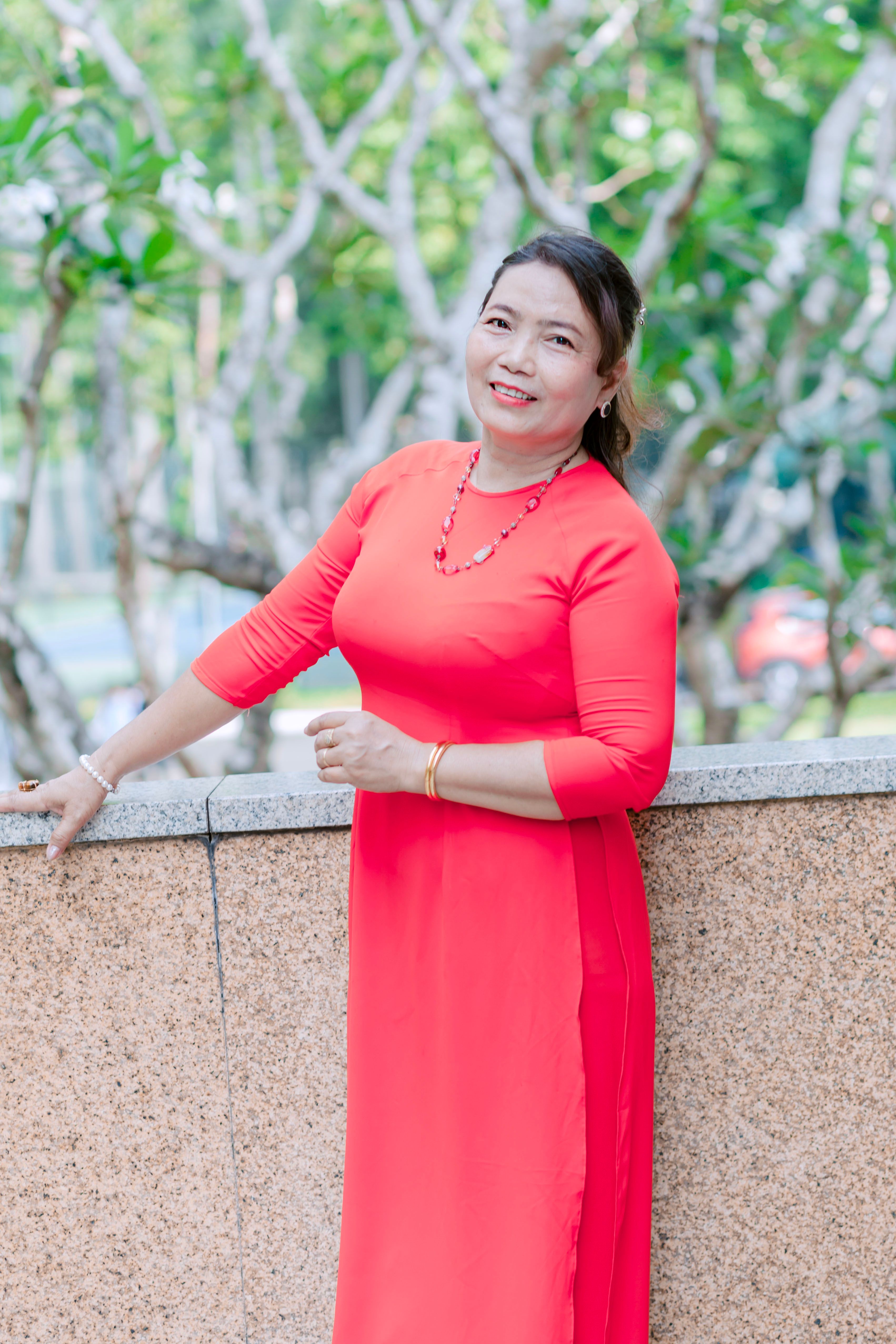 Woman Posing in a Red Dress · Free Stock Photo