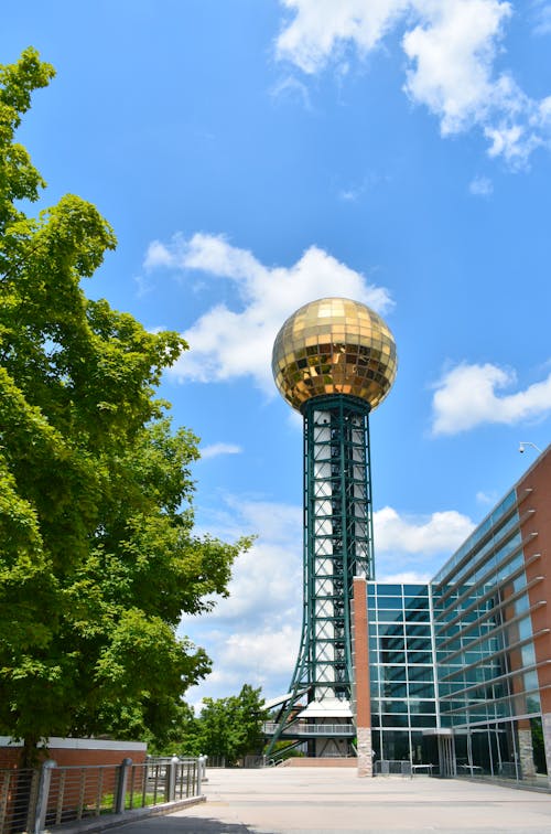 The golden ball tower is in the middle of a building