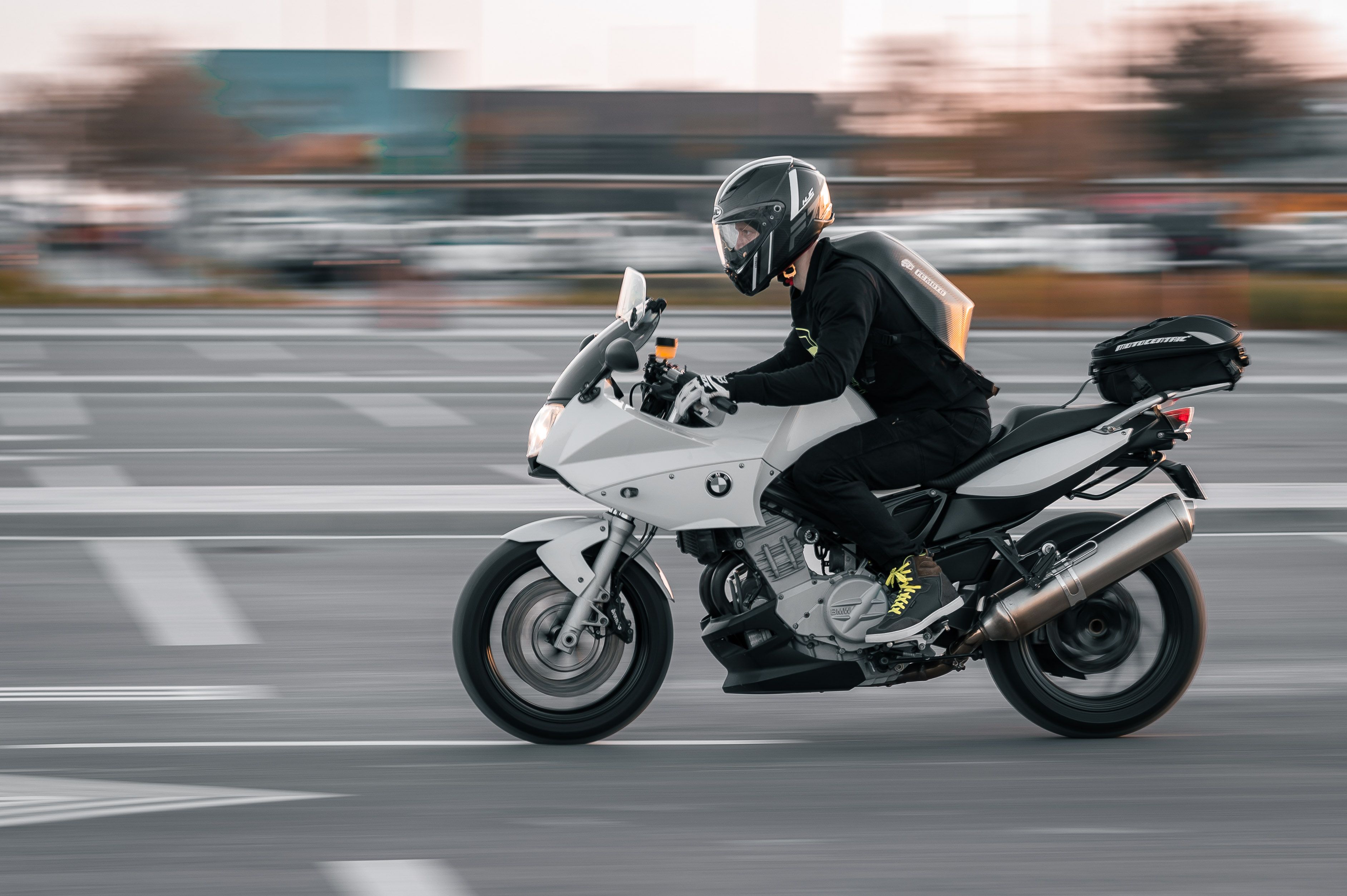 Motorcyclist Riding BMW F 800 on Asphalt · Free Stock Photo