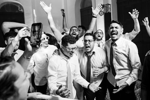 A group of men celebrating at a wedding