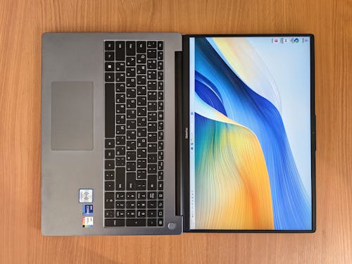 A laptop with a keyboard and a screen on top