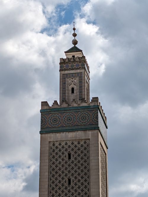 Free Vertical shot of the Grand Mosque of Paris minaret showcasing intricate Islamic architecture. Stock Photo
