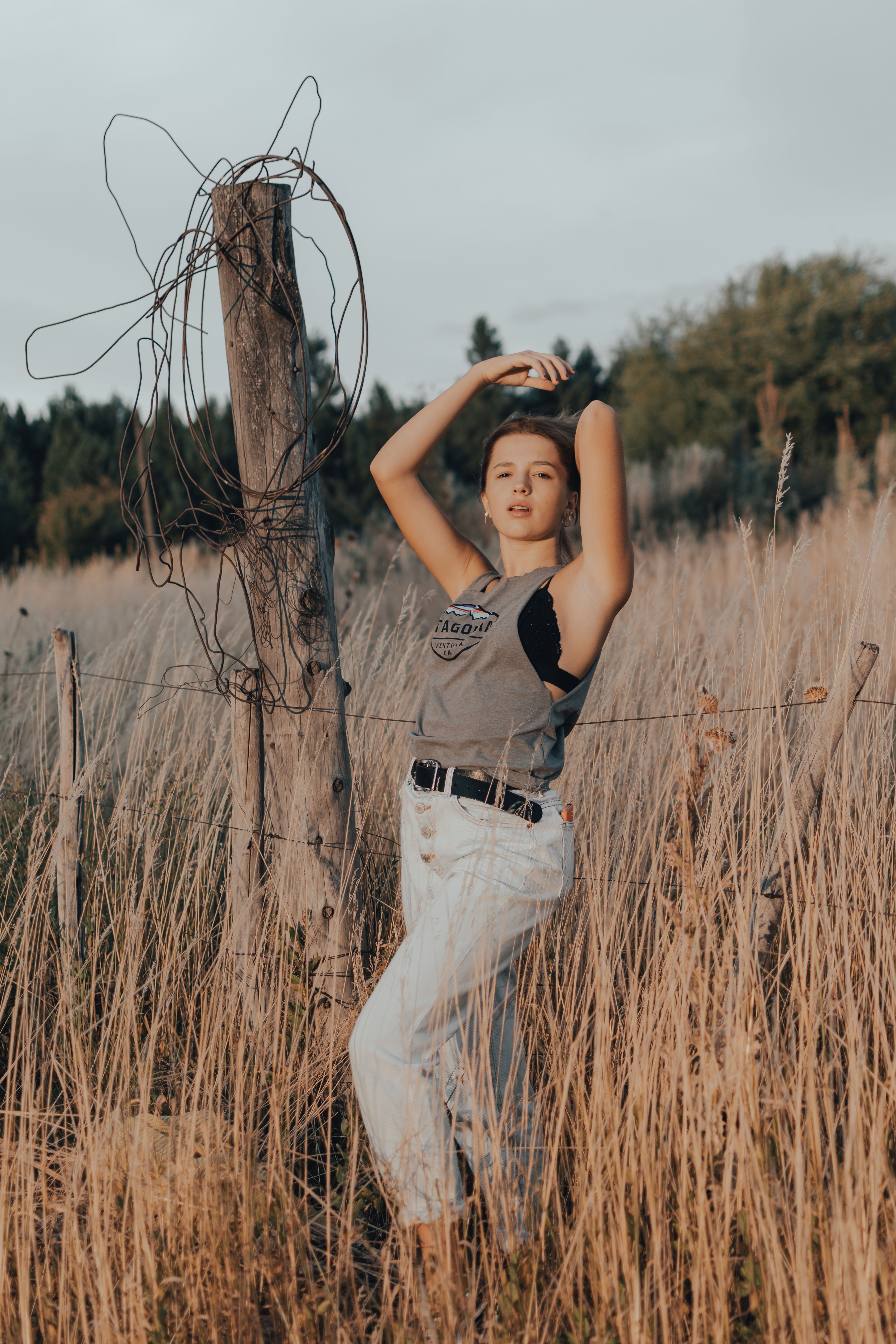 Model in Tank Top Posing in Countryside · Free Stock Photo