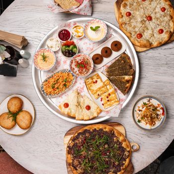 Vibrant Middle Eastern mezze platter showcasing a variety of delicious appetizers and flatbreads.
