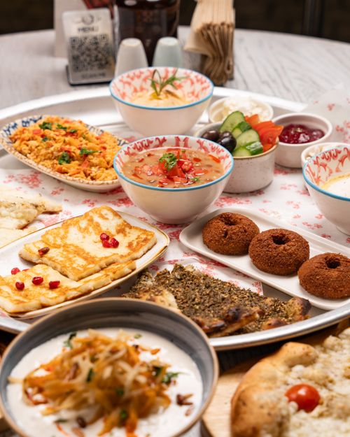 Free A diverse spread of Middle Eastern dishes beautifully presented on a dining table. Stock Photo
