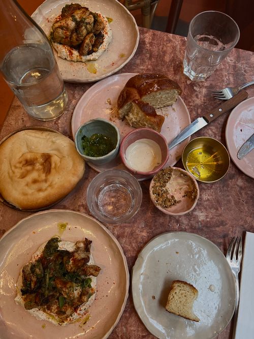 Free Aerial shot of a diverse meal setup on a rustic table, featuring gourmet dishes and beverages. Stock Photo