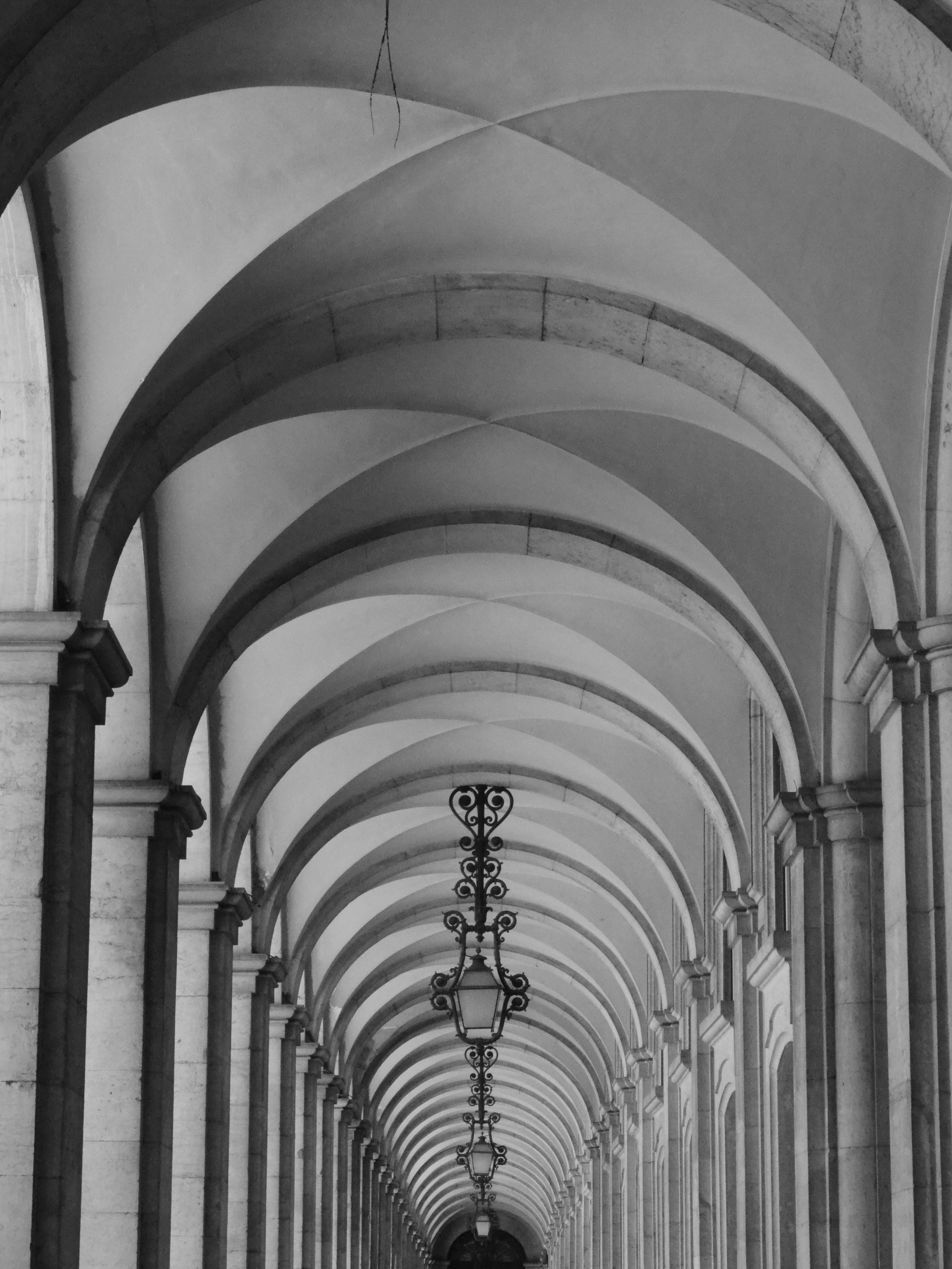 Dramatic black and white arches at Lisbon's Terreiro do Paço.
