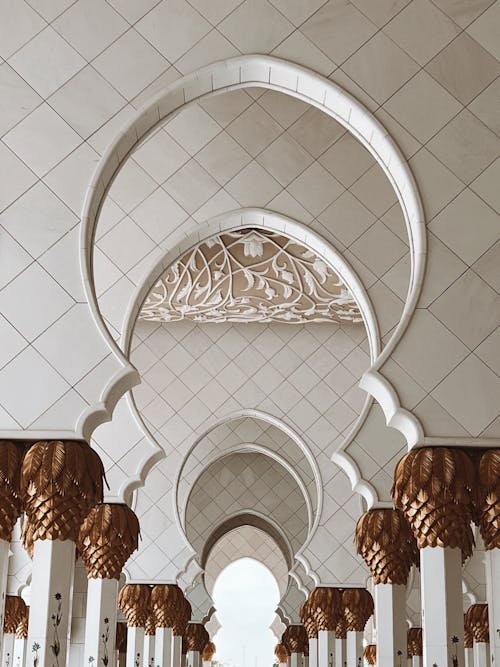 The interior of a mosque with arches and columns