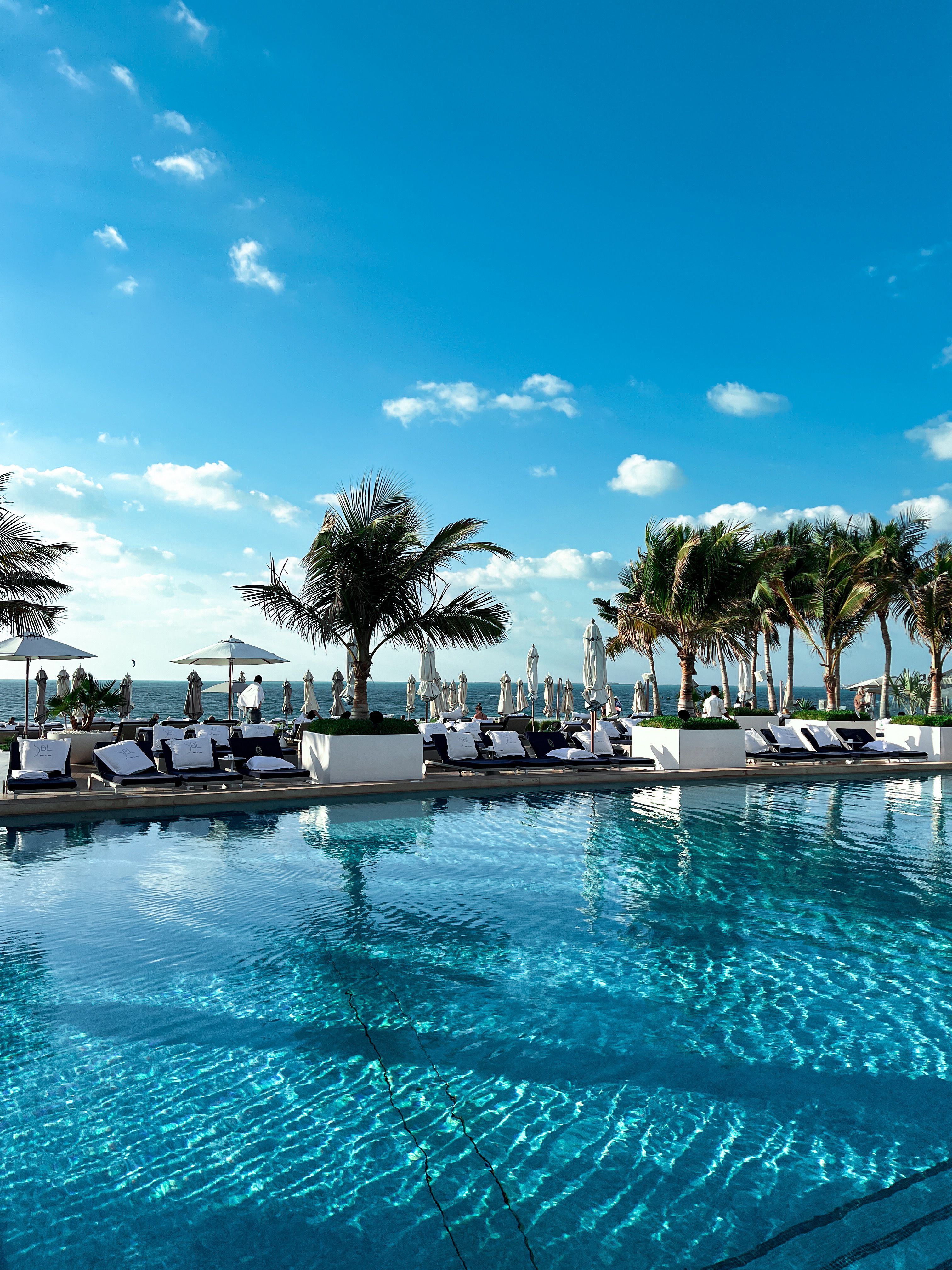 Luxury resort pool where resort fees at five star hotels may cover shared amenities
