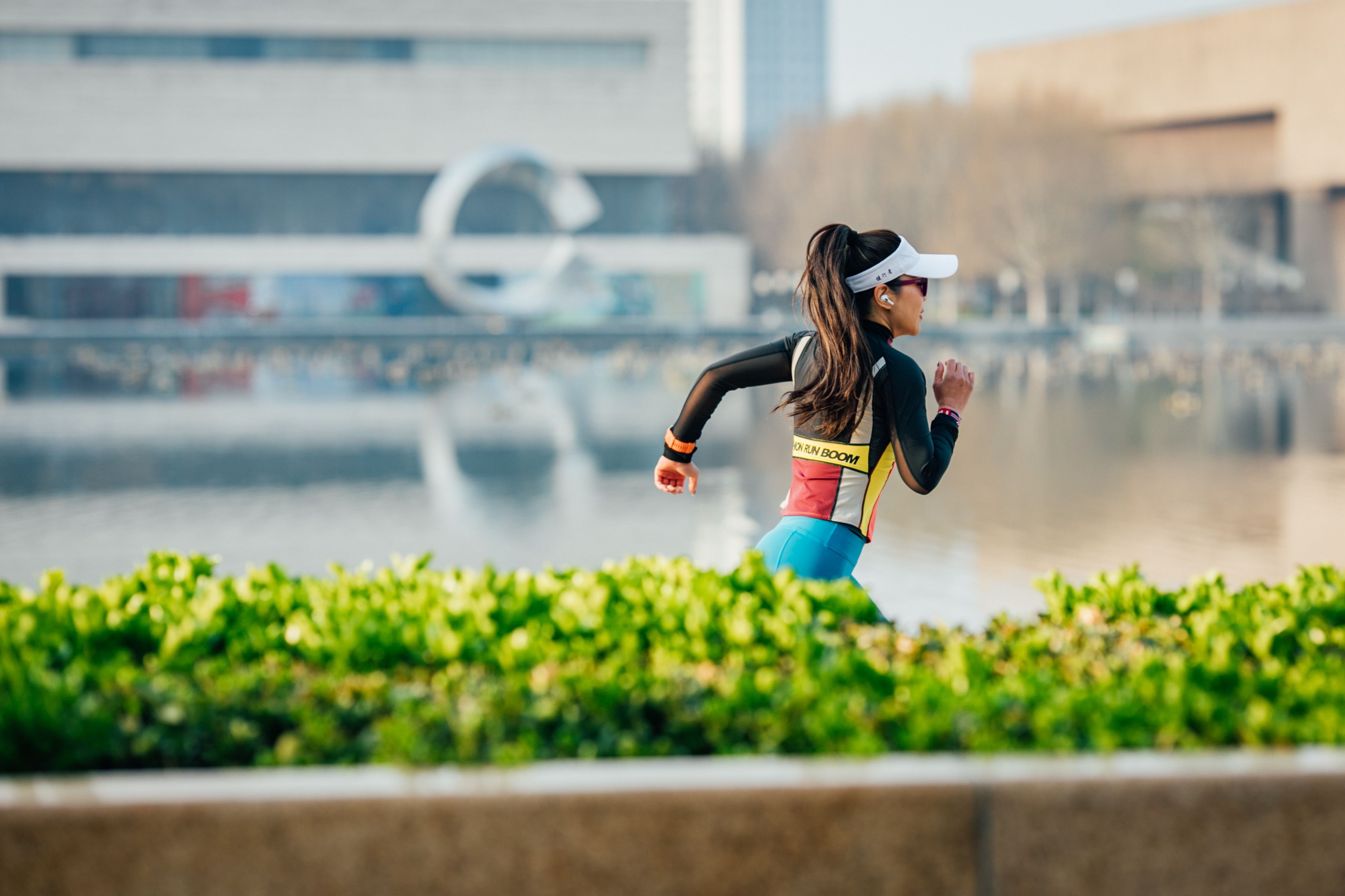 Runner moving along a lakeside path