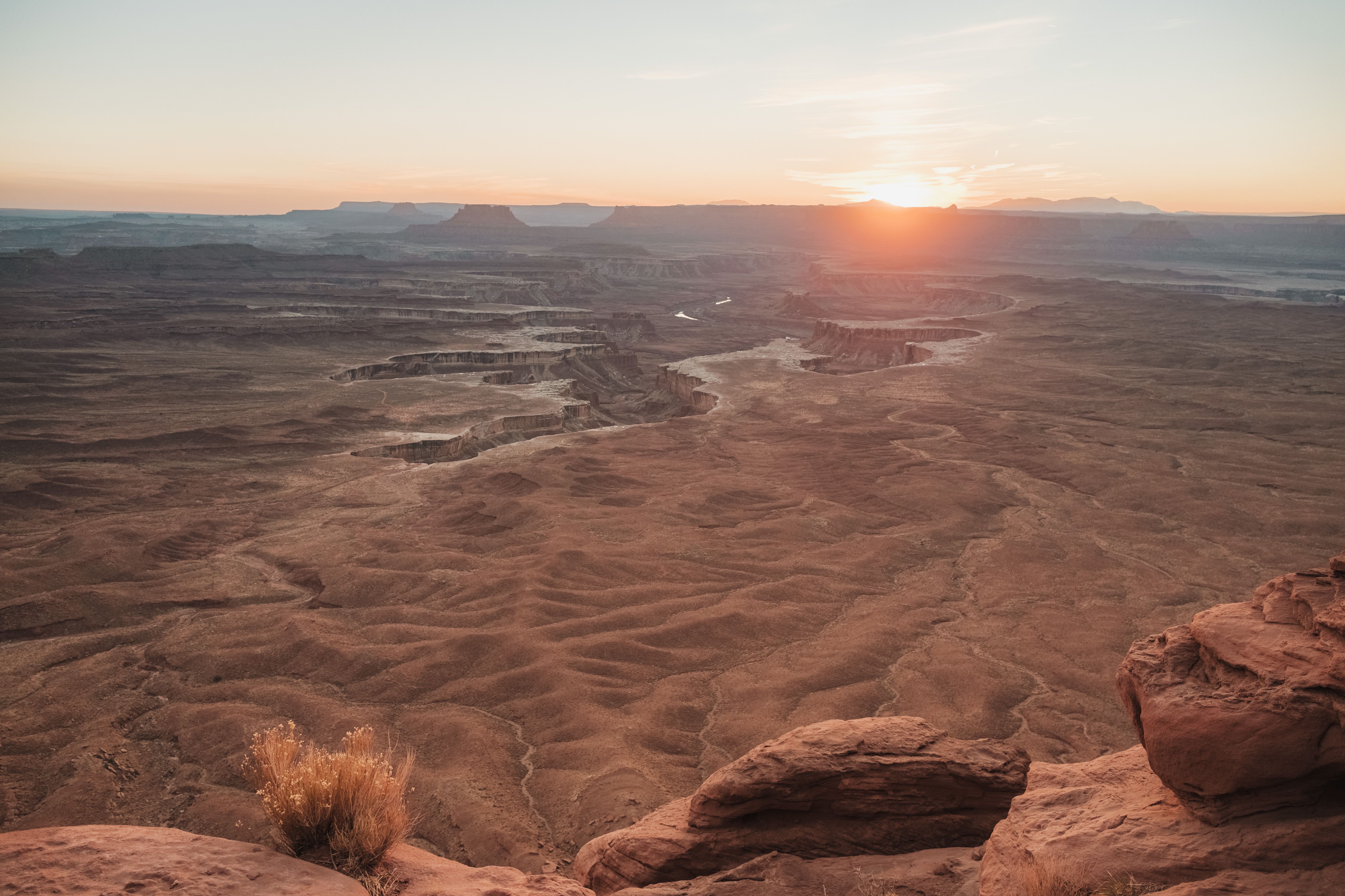 Breathtaking view of sunrise over the rugged landscape of Canyonlands National Park in Utah.