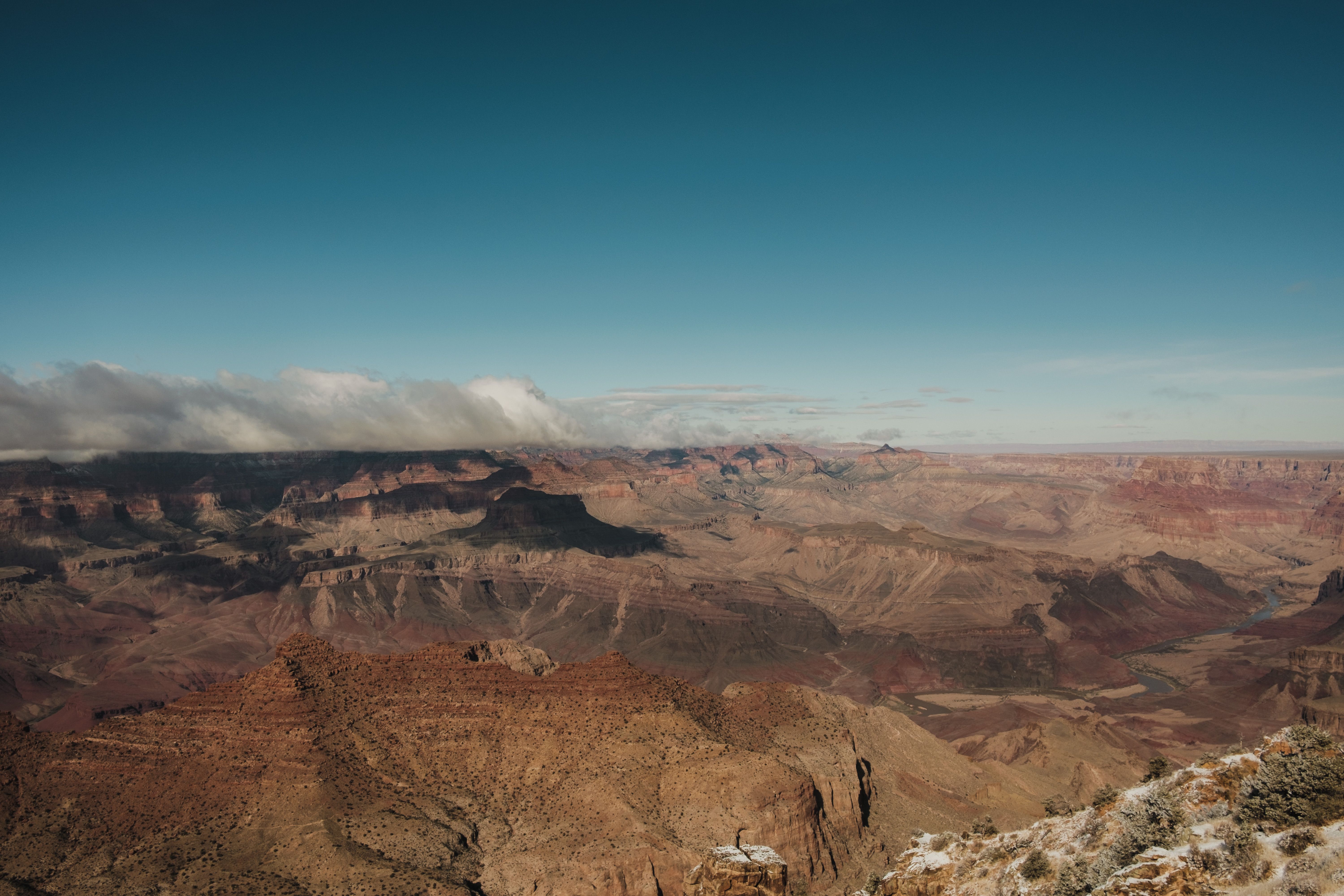 Unbeatable 25-min Grand Canyon South Rim EcoStar Helicopter Tour with Optional Hummer Review Review 2026 - Breathtaking panorama of the Grand Canyon with clear blue skies and red rock formations.