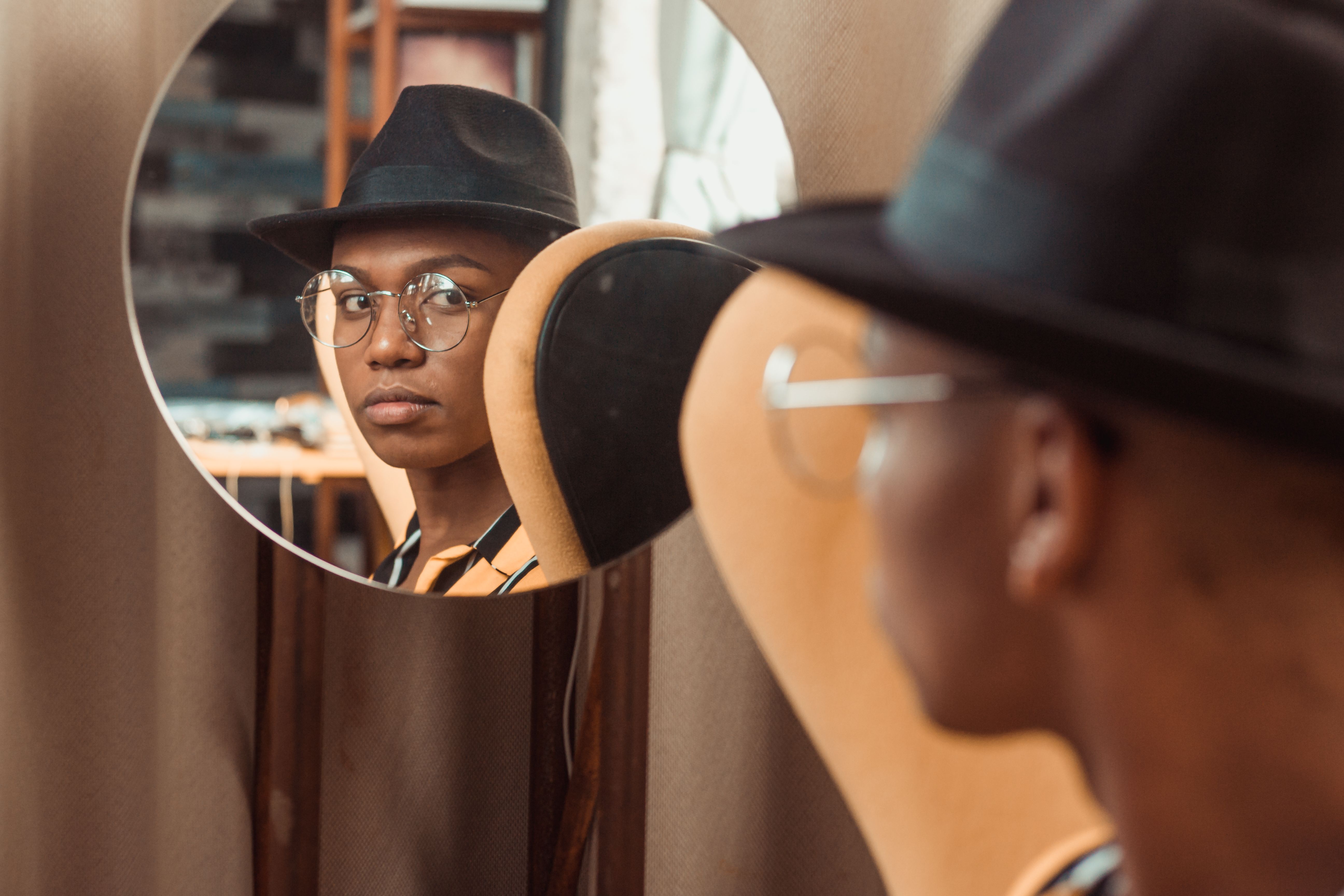Man Wearing Black Fedora Hat Looking At 