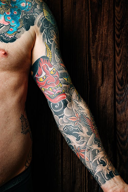 Person Showing His Tattoo · Free Stock Photo
