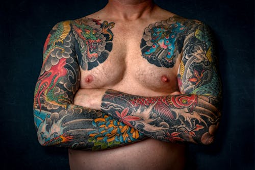 Free Man Showing His Arm Tattoos Stock Photo