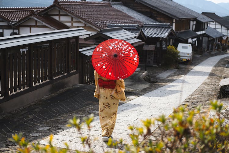 Woman Wearing A Kimono Holding Umbrella