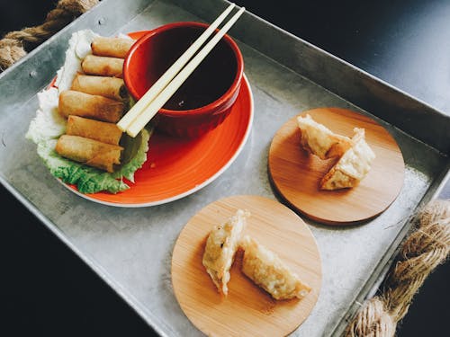 Fried Spring Rolls and Dumplings on Top of Tray