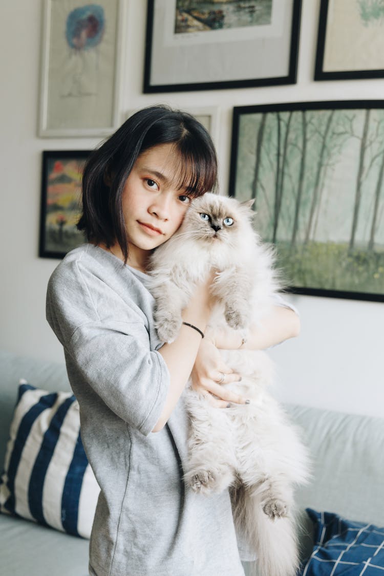 Woman Hugging Himalayan Cat