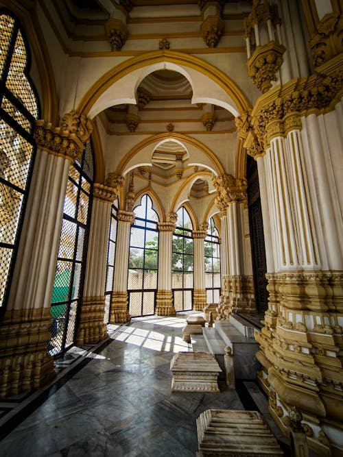 The inside of a building with columns and arches