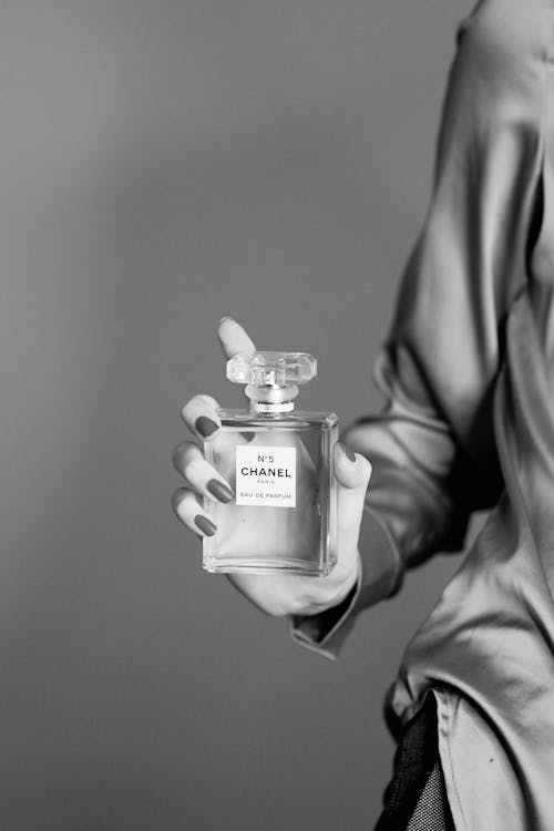 Woman Holding Bottle of Chanel No 5