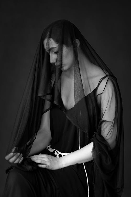 Woman Sitting in Veil in Black and White