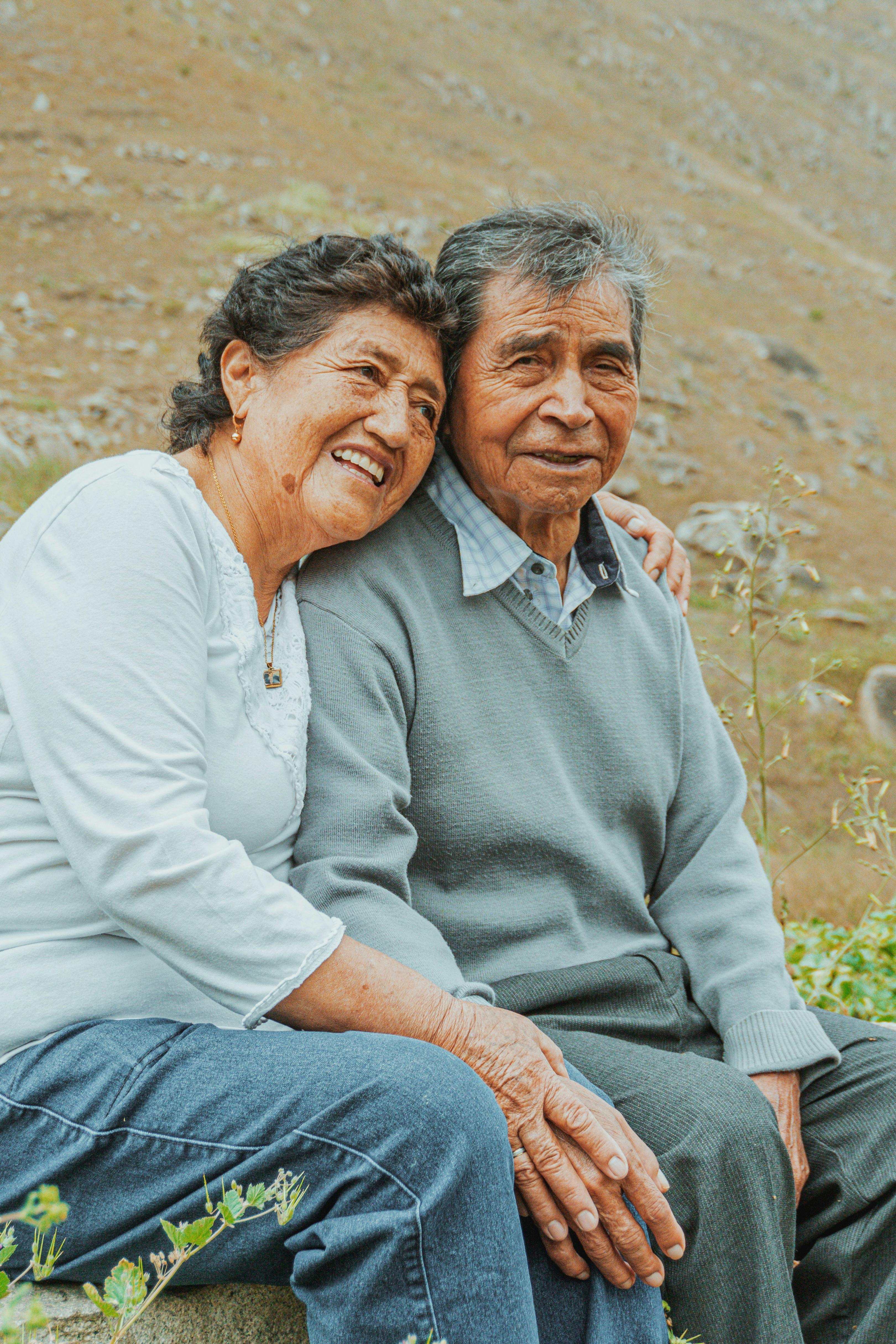 embracing loving elderly couple