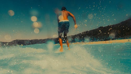 A man riding a surfboard in the water