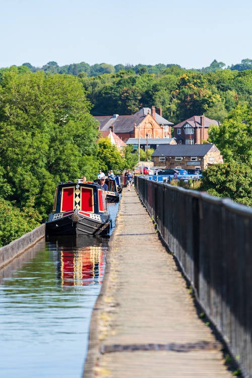 A boat is on a bridge over a canal