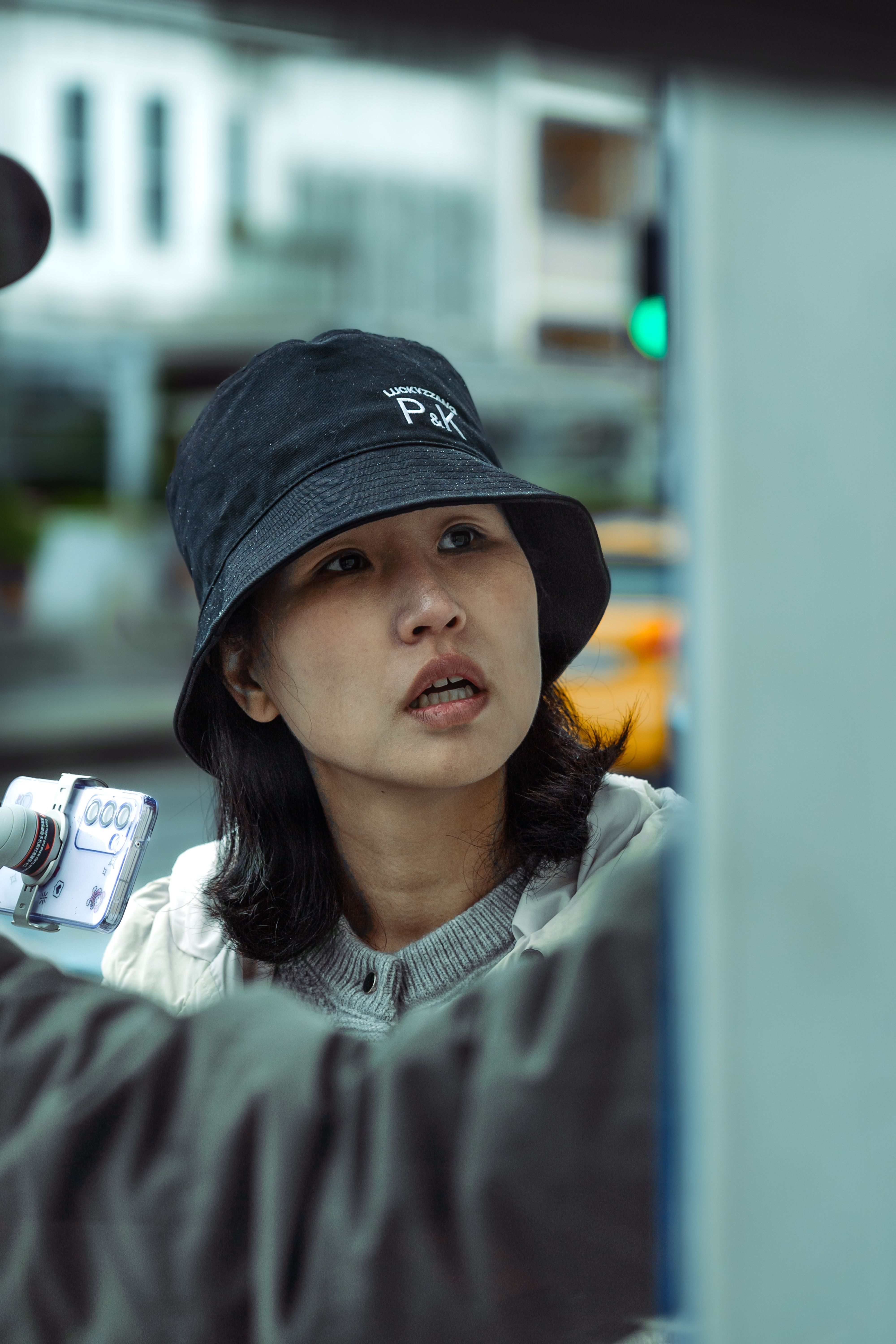 Model wearing a hat and streetwear accessories