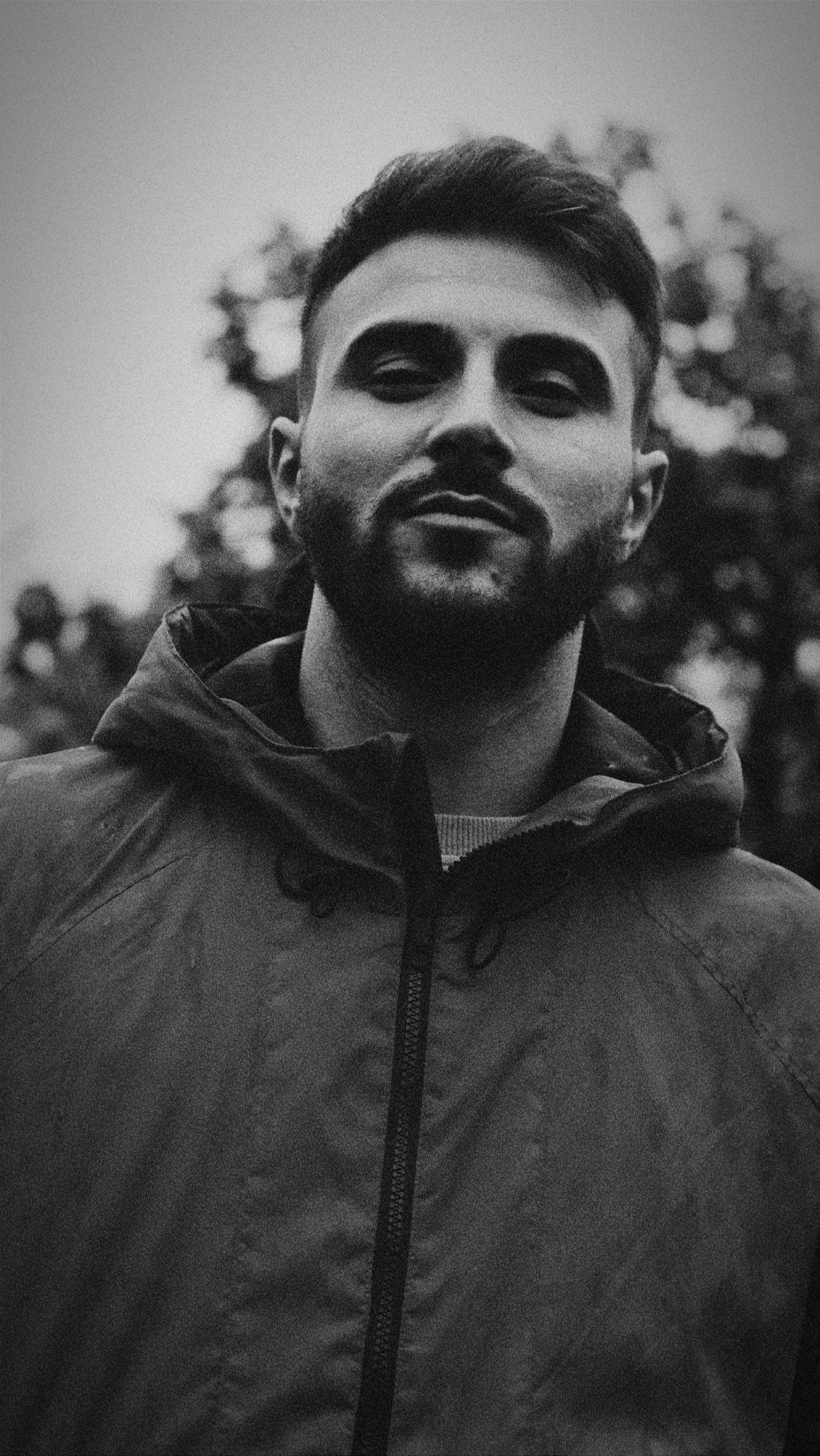 Stylish black and white outdoor portrait of a young man in İstanbul.