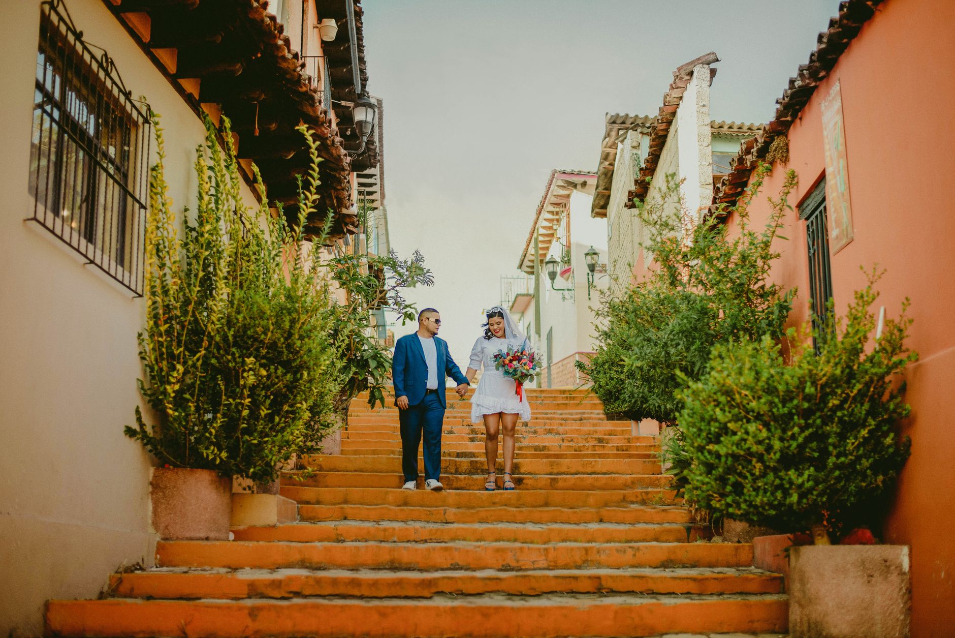 Couple walking through colorful small town steps