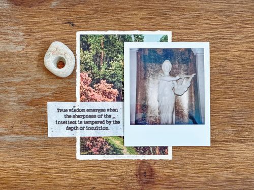 Free A polaroid and postcard on a wooden surface with a stone and insightful message. Stock Photo
