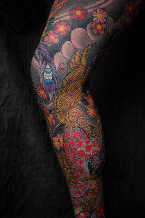 Multicolored Floral Leg Tattoo