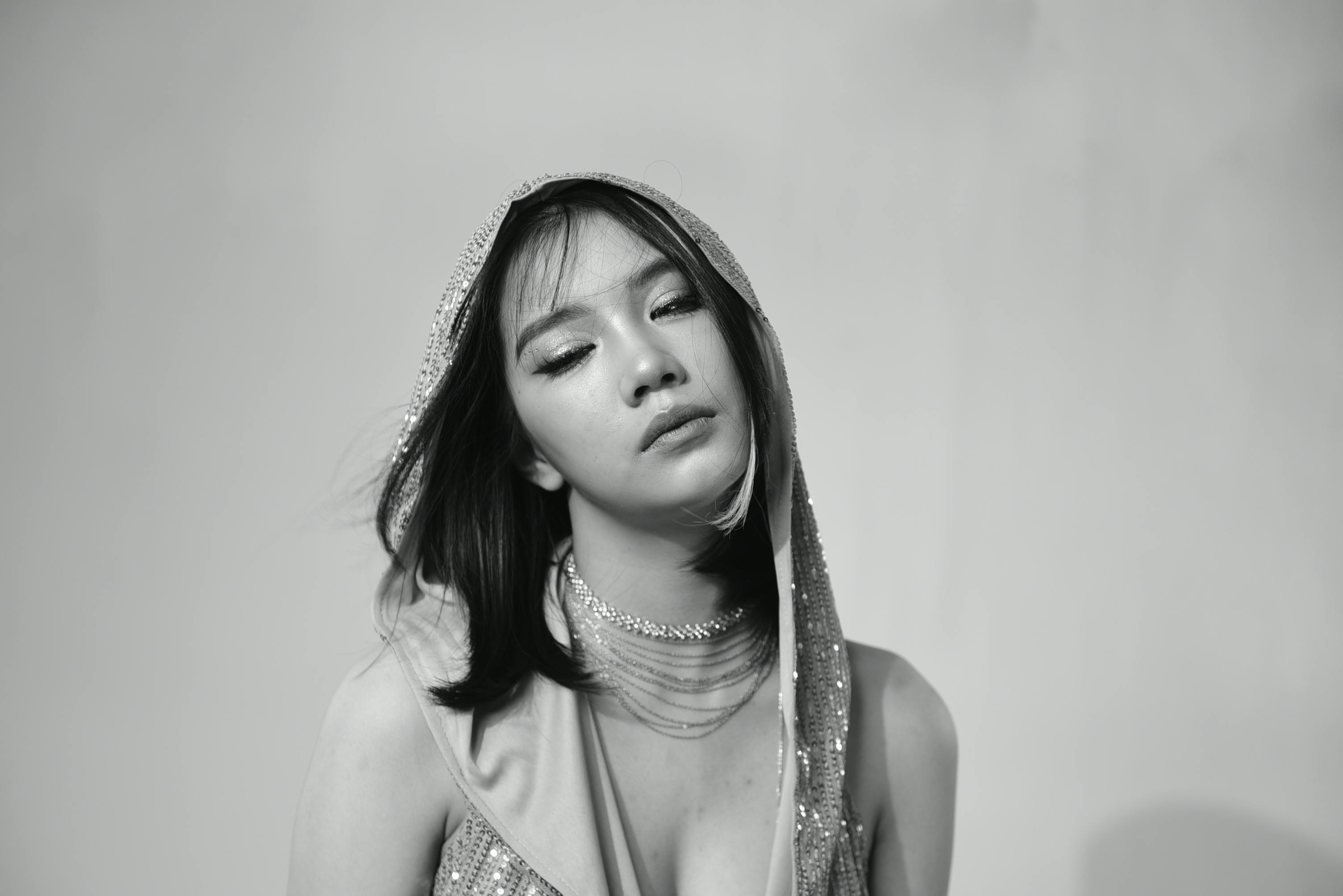 A woman in a dress with her head down