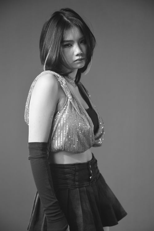 Free Stylish black and white portrait of a fashionable woman in a studio setting. Stock Photo