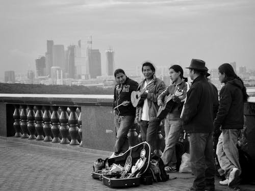 A group of people playing music on the bridge