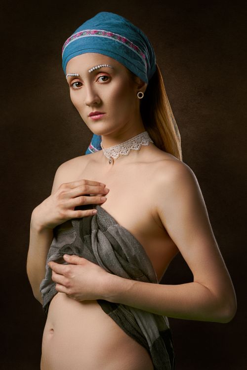Free Artistic portrait of a woman wearing a headscarf and lace choker, exuding elegance and style. Stock Photo