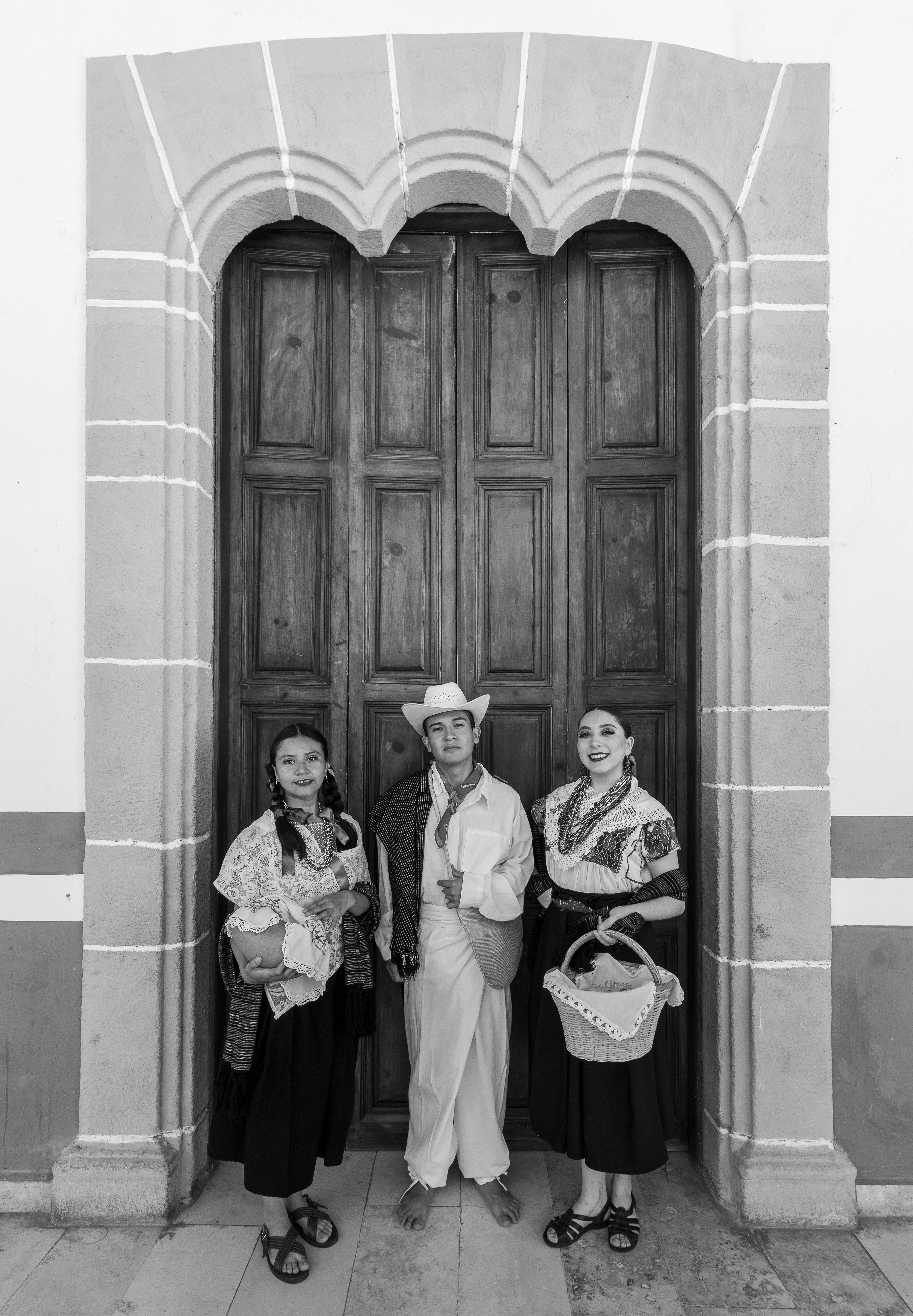Three women standing in front of a door · Free Stock Photo