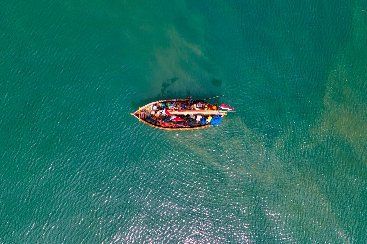 A traditional fishing boat on tropical Indonesian waters