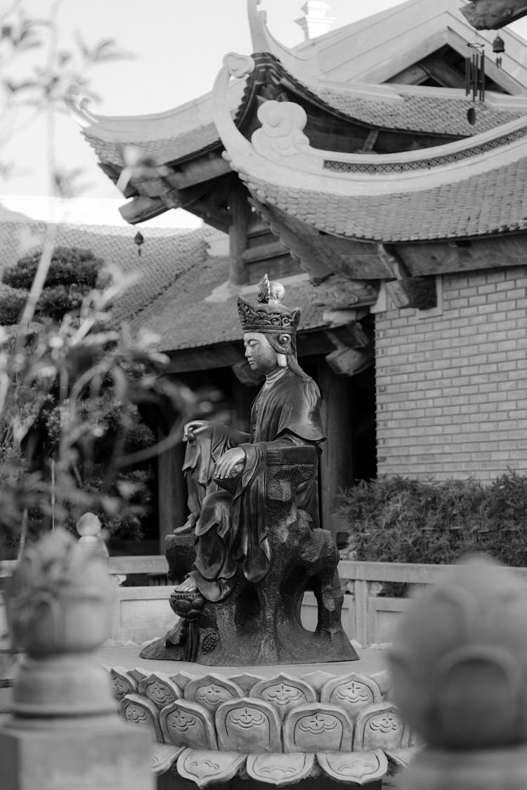 Statue Of Sitting Man In Asian Temple