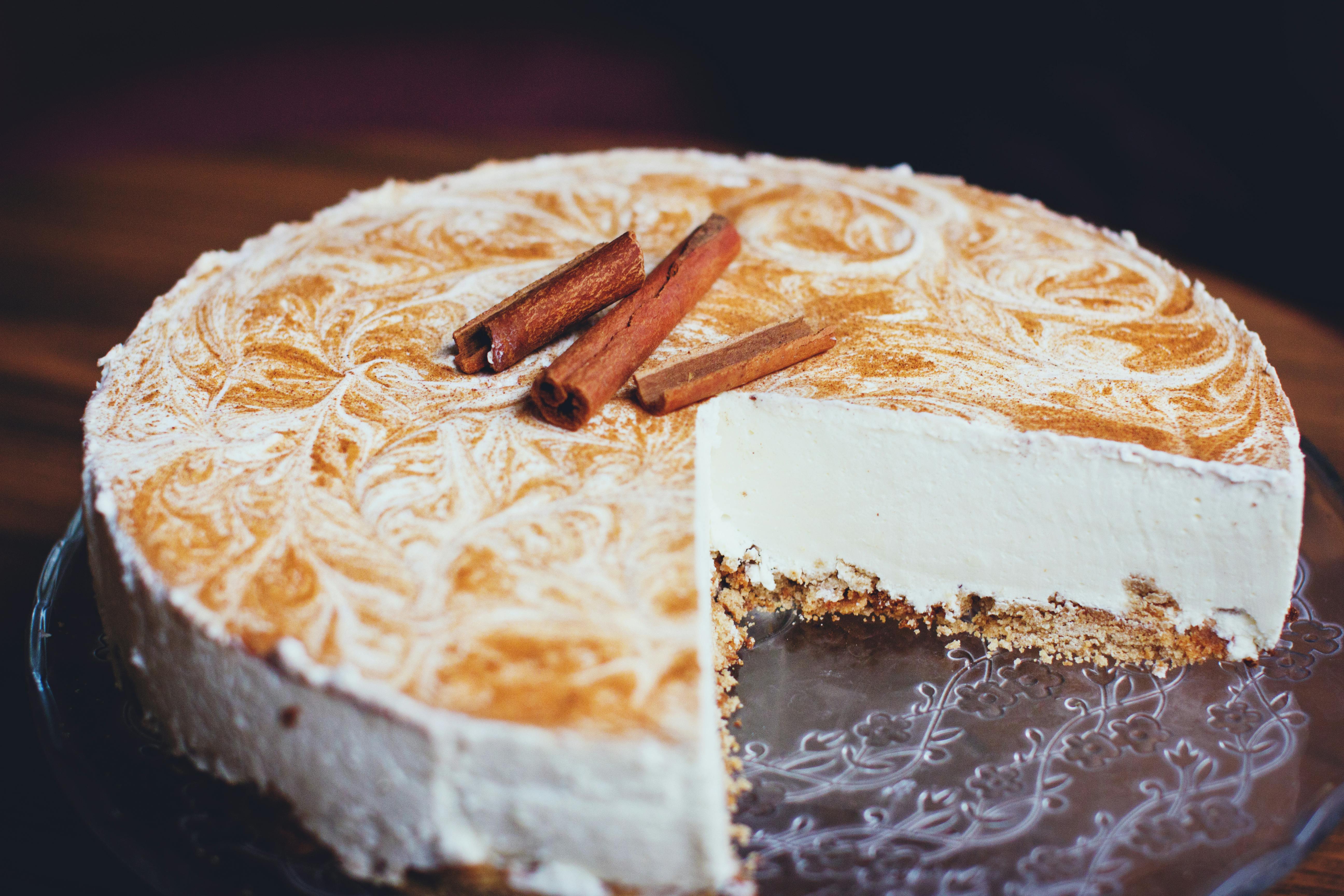 white cheesecake on wooden surface