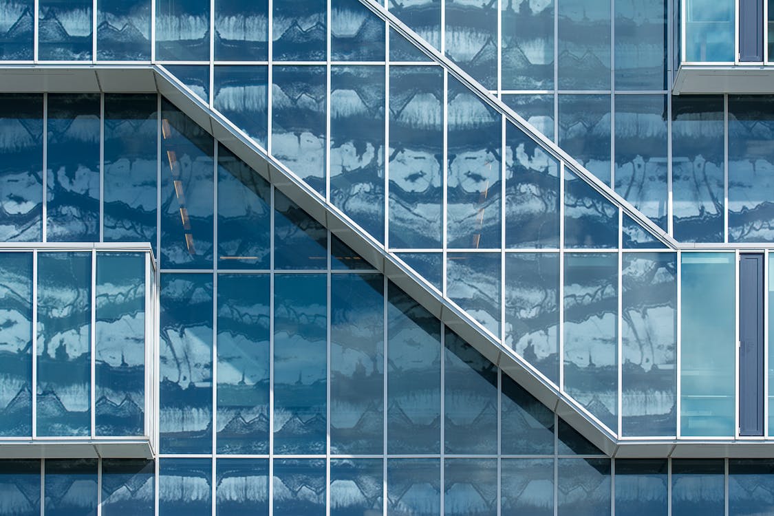 A close up of a glass building with a staircase