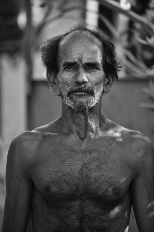 Free Moody black and white portrait of an elderly topless man outdoors. Stock Photo
